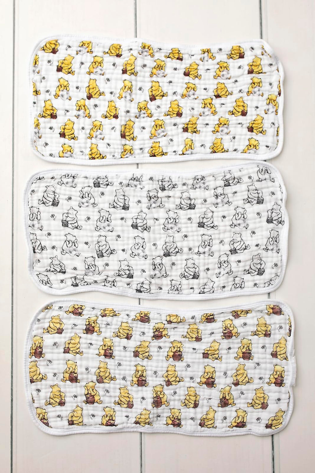 Sugar Lily's-Classic Pooh Muslin Cotton Burp Cloth Set. 1 of Each- Full Color,Design, Full Color w/Soccer Ball Motifs, Black & White Design w/Soccer Ball Motif.